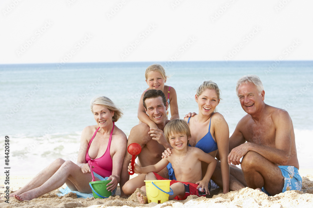 Portrait Of Three Generation Family On Beach Holiday Portrait Of Three Generation Family On Beach Holiday