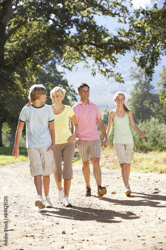 Middle Aged Family Walking Through Countryside