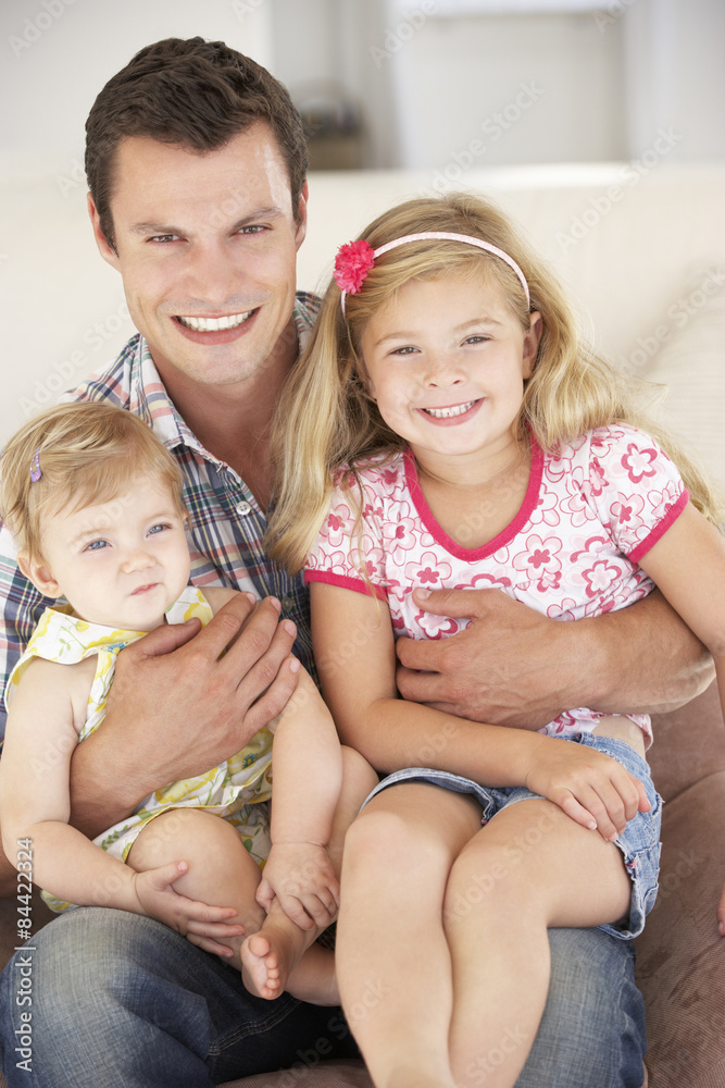 Father Relaxing with Daughters At Home Father Relaxing with Daughters At Home