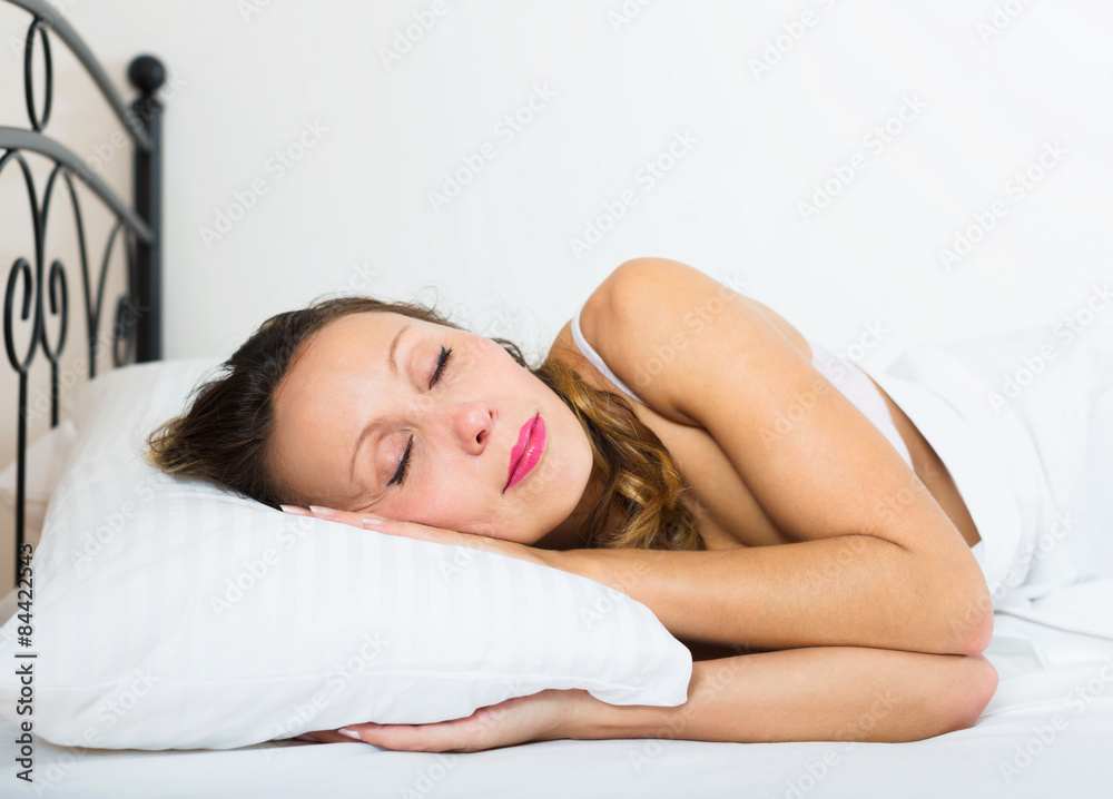 Foto de woman sleeping in underwear do Stock