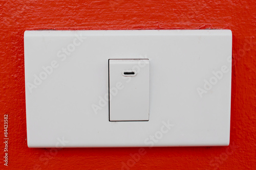 Wall switch on the red wall