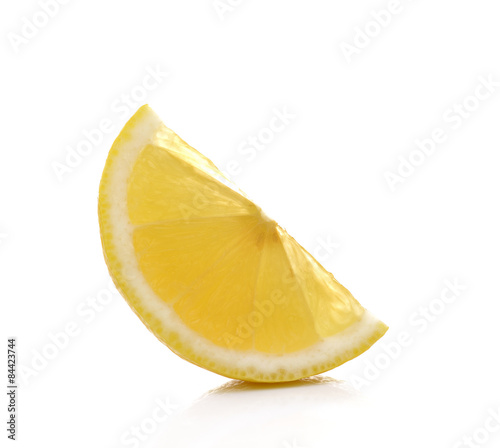 Slice of fresh lemon isolated on white background