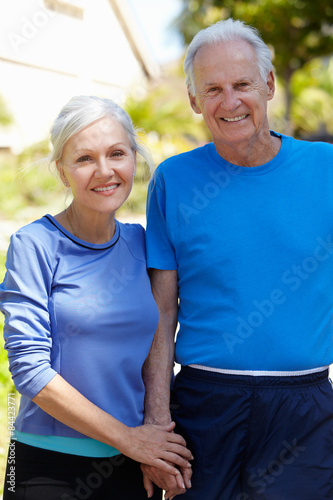 Elderly man and younger woman outdoors