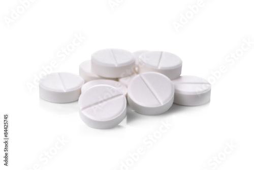 white pills on white background
