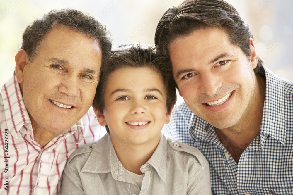 Portrait Of Hispanic Grandfather, Adult Father And Son Relaxing At Home Portrait Of Hispanic Grandfather, Adult Father And Son Relaxing At Home