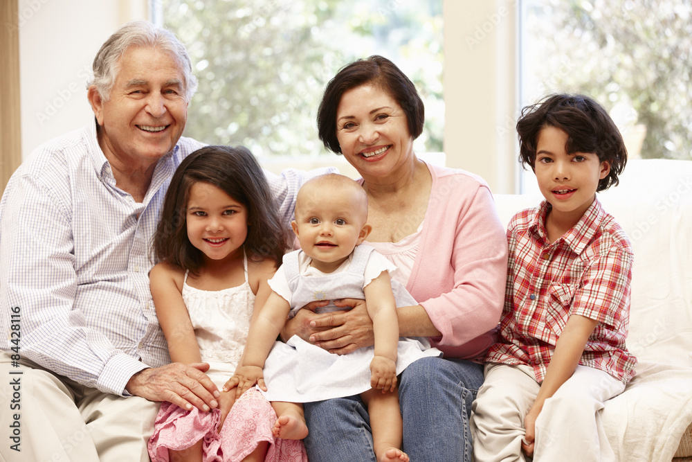 Hispanic grandparents at home with grandchildren Hispanic grandparents at home with grandchildren