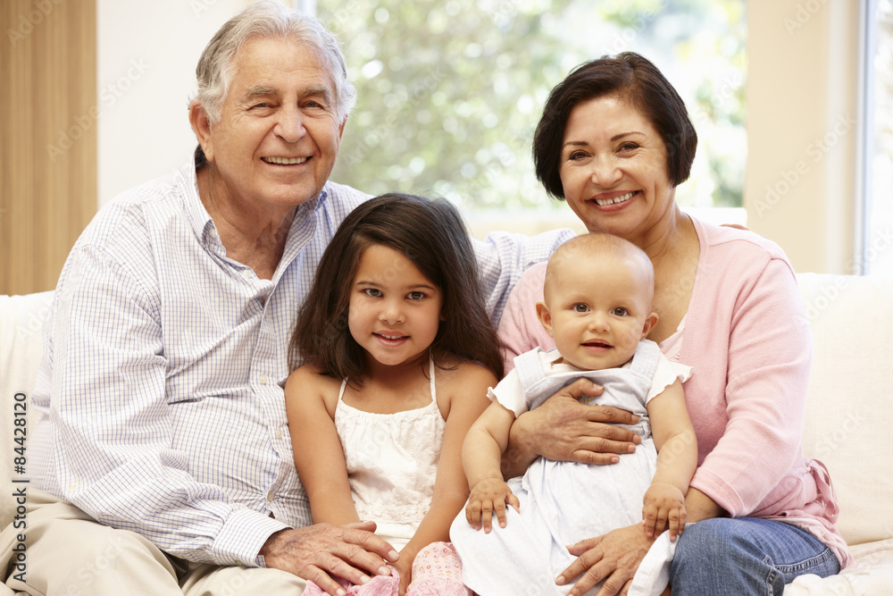 Hispanic grandparents at home with grandchildren Hispanic grandparents at home with grandchildren