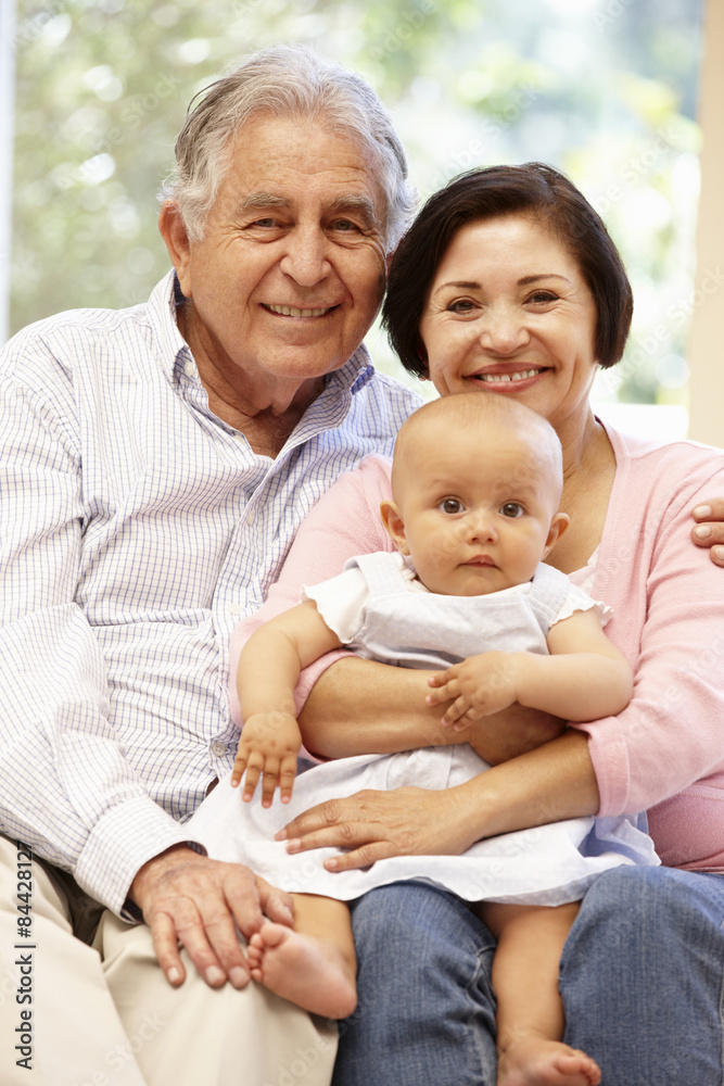 Hispanic grandparents at home with grandchild Hispanic grandparents at home with grandchild