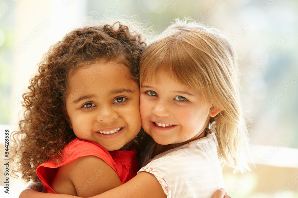 Two little girls hugging Two little girls hugging