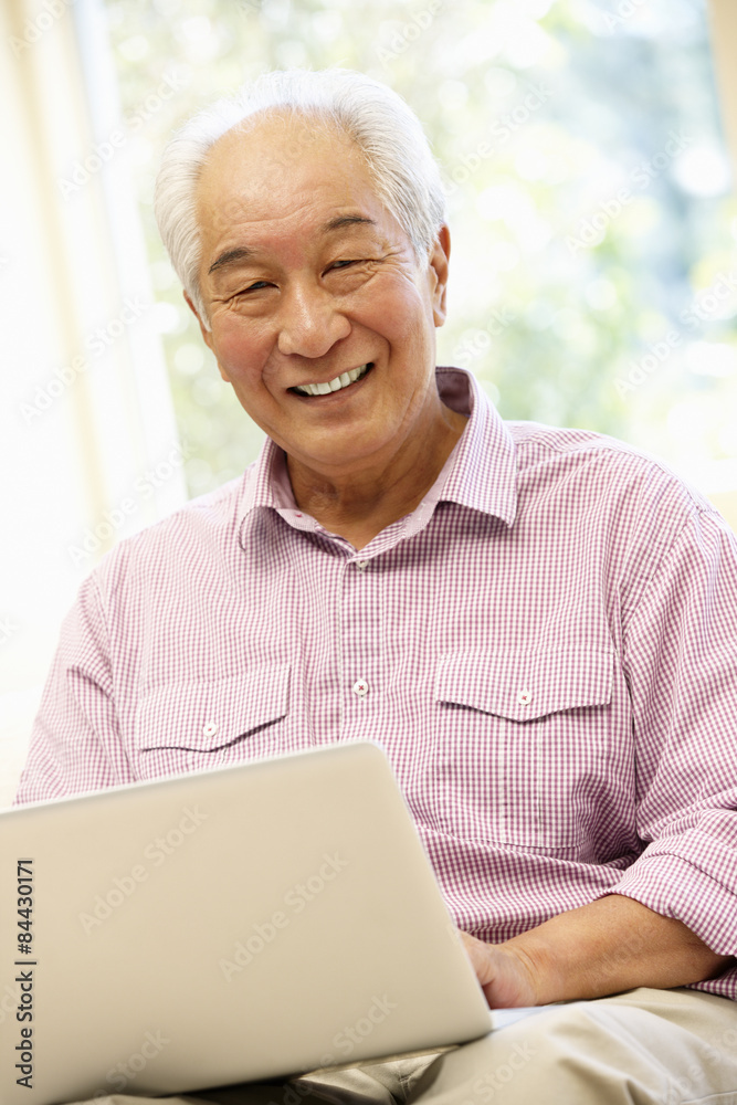 Senior Asian man using laptop Senior Asian man using laptop