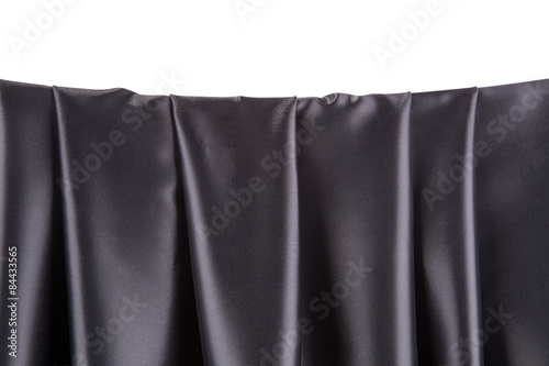 Soft folds of black silk cloth.