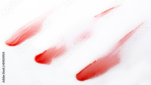 Red lip gross brush stroke on white background