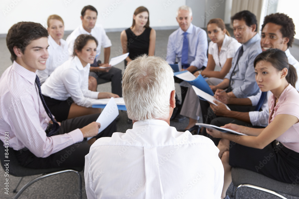 Fototapeta premium Businesspeople Seated In Circle At Company Seminar