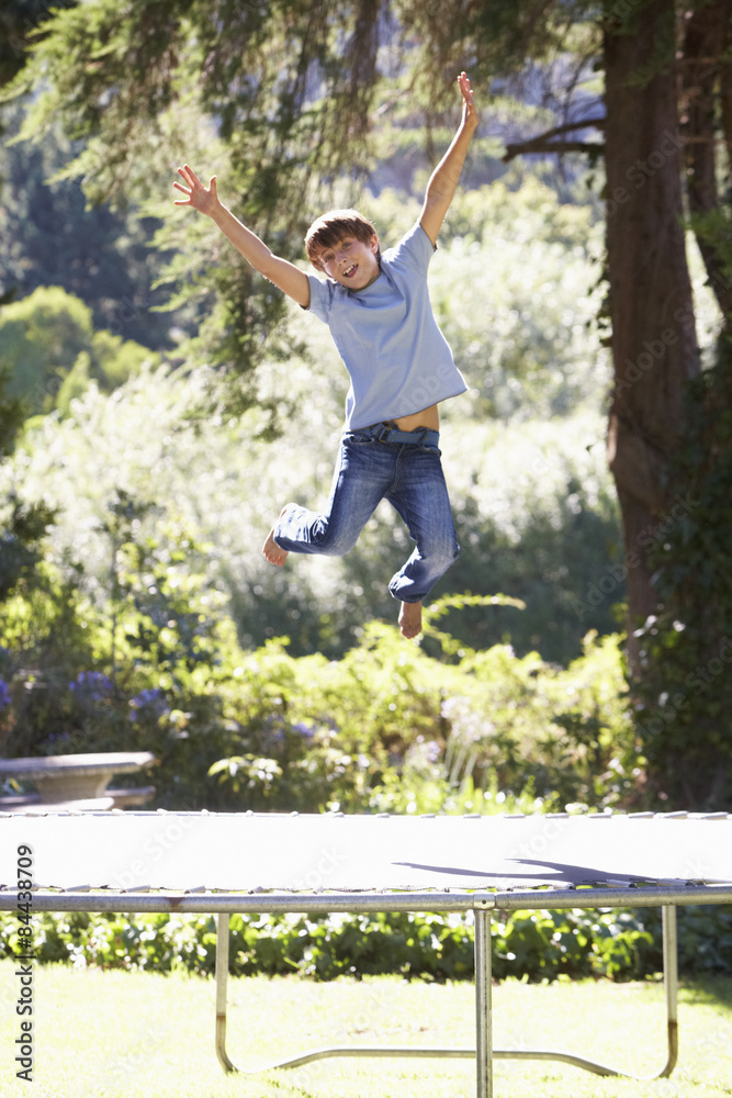 Young Boy Having Fun On Trampoline