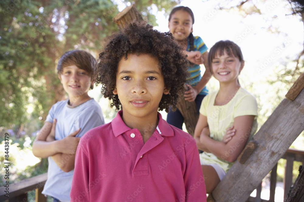 Group Of Children Hanging Out In Treehouse Together Group Of Children Hanging Out In Treehouse Together