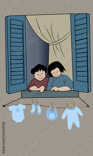 Pareja en la ventana con ropa de bebé tendida.