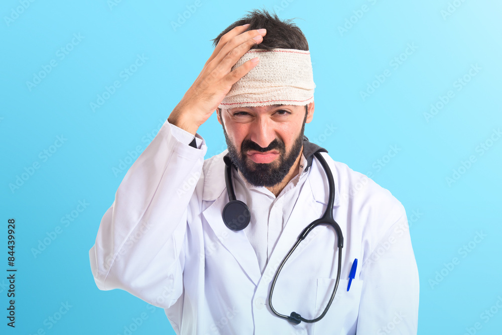 Doctor with headache over white background Doctor with headache over white background