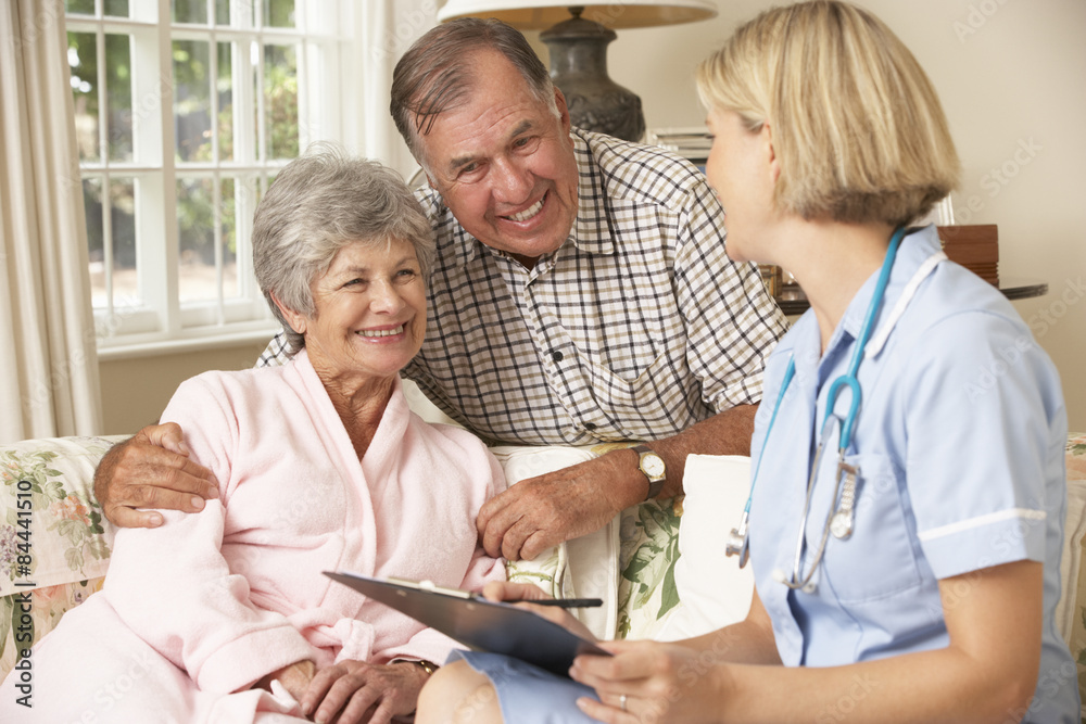 Obraz premium Retired Senior Woman Having Health Check With Nurse At Home