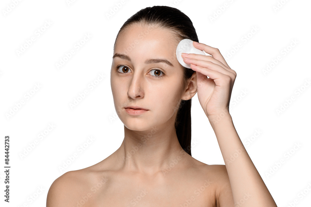skin care woman removing face with cotton swab pad