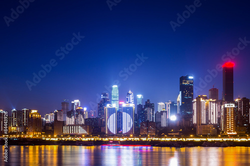 Fototapeta Naklejka Na Ścianę i Meble -  illuminated skyline of chongqing at riverbank