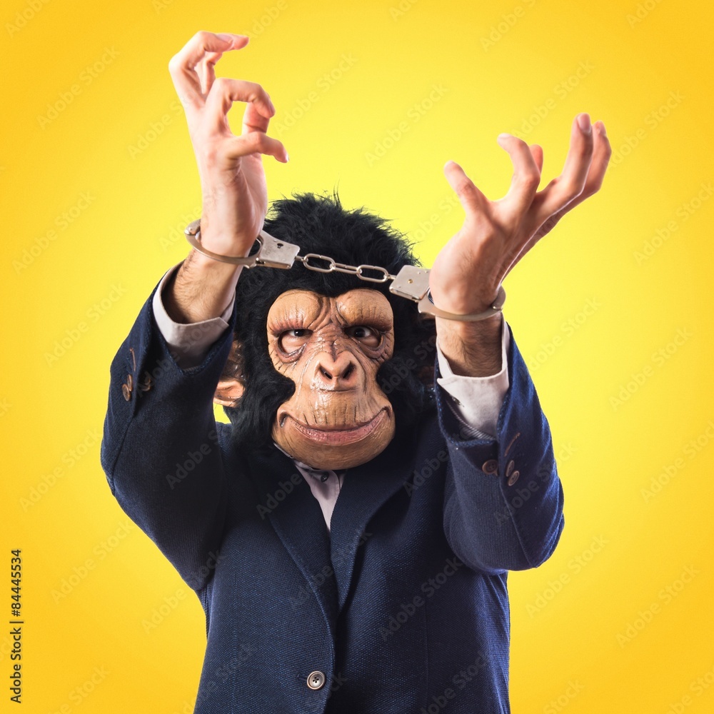 Naklejka premium Monkey man with handcuffs
