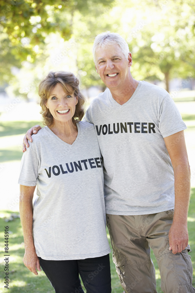 Senior Couple Working As Part Of Volunteer Group