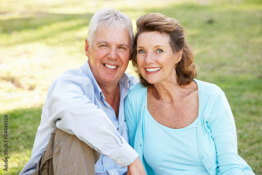 Portrait Of Senior Couple Relaxing In Park Portrait Of Senior Couple Relaxing In Park