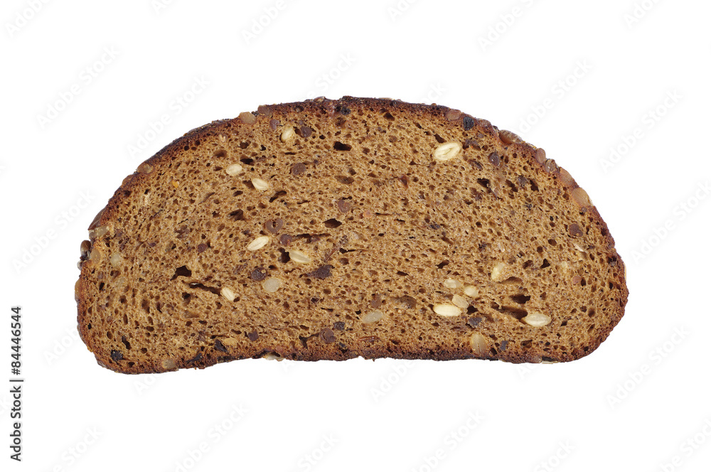 Slice of black bread with sunflower seeds, nuts, raisins and dri Slice of black bread with sunflower seeds, nuts, raisins and dri