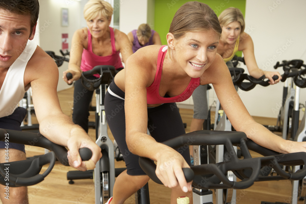 Group Taking Part In Spinning Class In Gym Stock Photo | Adobe Stock