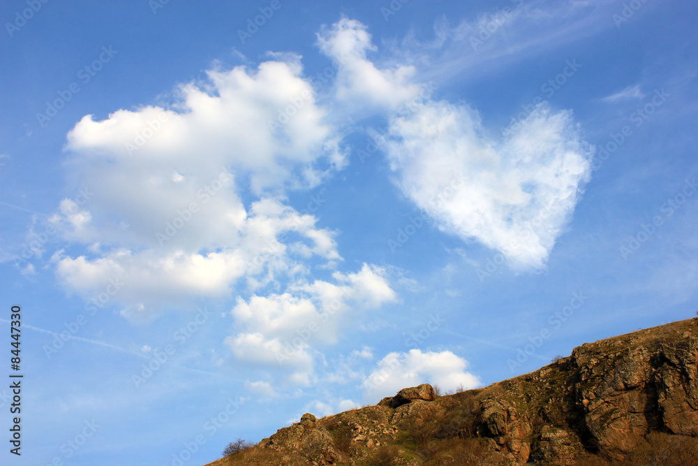 Heart from cloud on blue sky background