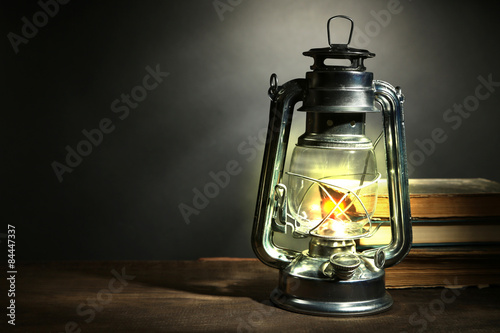 Kerosene lamp and letters on dark grey background