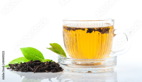 Glass Cup Tea with green leaves, Isolated on White Background.