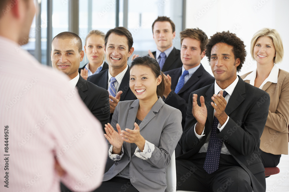 Group Of Business People Applauding Speaker At The End Of A Presentation Group Of Business People Applauding Speaker At The End Of A Presentation