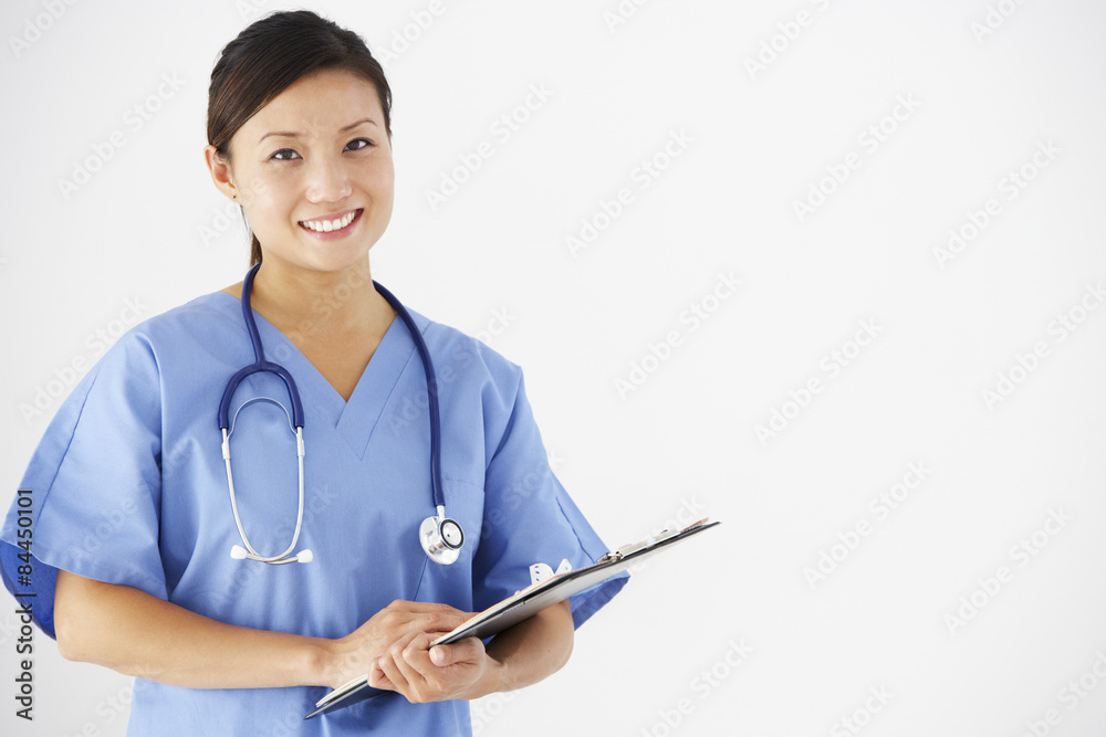 Studio Portrait Of Nurse Against White Background Studio Portrait Of Nurse Against White Background