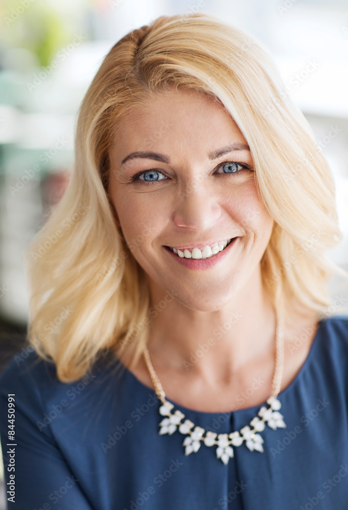 happy smiling blonde woman in blue clothes happy smiling blonde woman in blue clothes