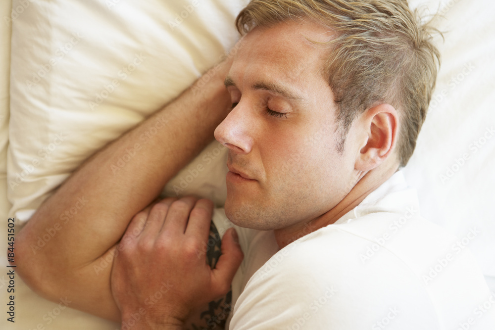 Man Sleeping In Bed