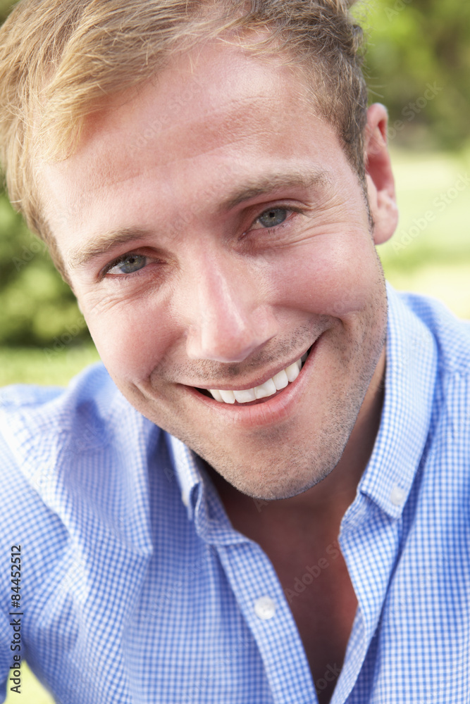 Fototapeta premium Head And Shoulders Portrait Of Smiling Man