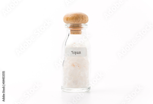 topaz in glass bottle isolated