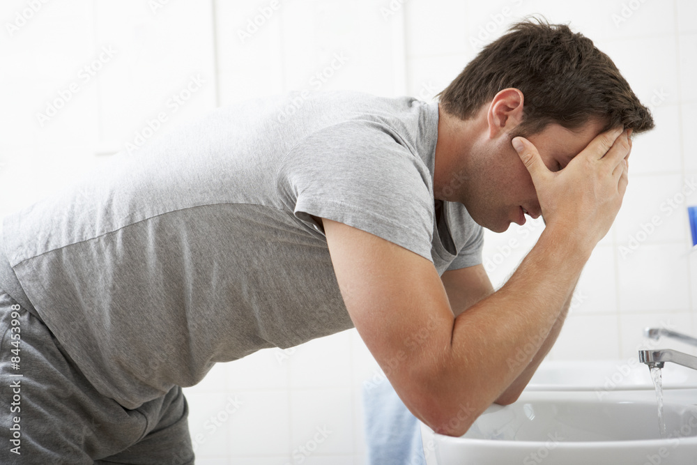 Tired Man In Standing At Bathroom Sink Tired Man In Standing At Bathroom Sink