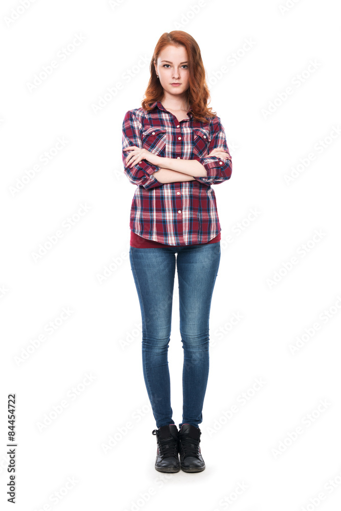Full-length portrait of a beautiful young red-haired girl lookin Full-length portrait of a beautiful young red-haired girl lookin
