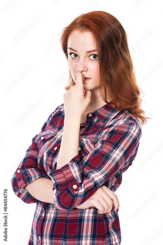 Portrait of surprised beautiful young red-haired girl looking at Portrait of surprised beautiful young red-haired girl looking at