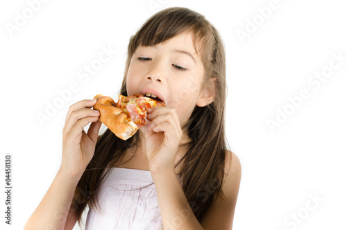 Little girl eating pizza on white background