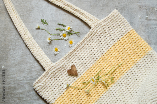 summer knitted handbag and daisy petals