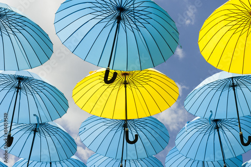 Yellow umbrellas under a sunny sky