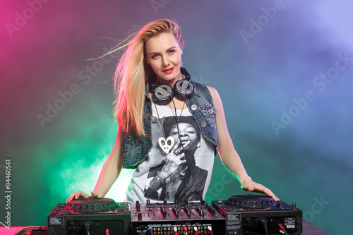 Bilde på lerret Beautiful blonde DJ girl on decks - the party,