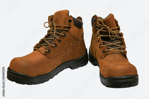Safety boots isolated on white background, close up new boots on white background, Worker used boots shoe in heavy industry for protected them foot.