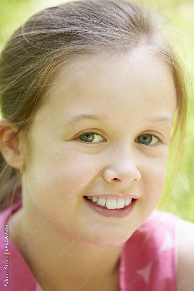 Portrait Of Young Girl Sitting In Field Portrait Of Young Girl Sitting In Field
