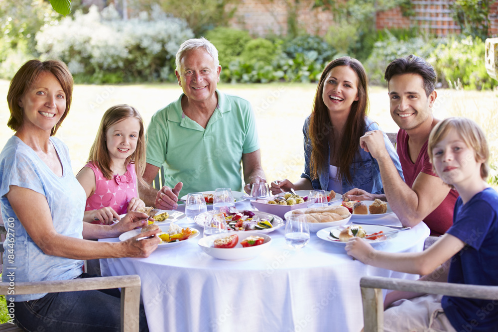 Multi Generation Family Enjoying Outdoor Meal Together Multi Generation Family Enjoying Outdoor Meal Together