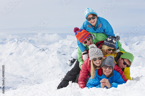 Group Of Friends Having Fun On Ski Holiday In Mountains