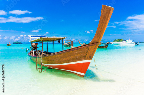 Wood boat and islands in andaman sea against blue sky at Lipe © themorningglory